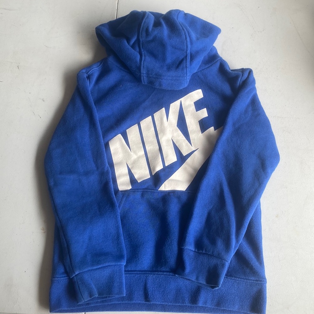Blue with white Nike 4T sweatshirt. Dark marks on one sleeve.